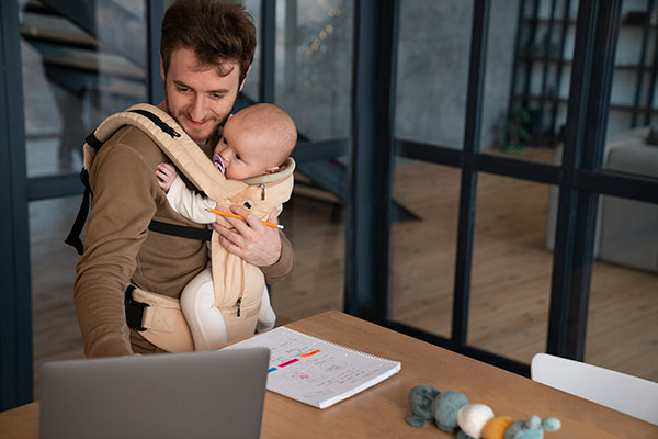 Medium Shot Father Working While Holding Baby Optimised