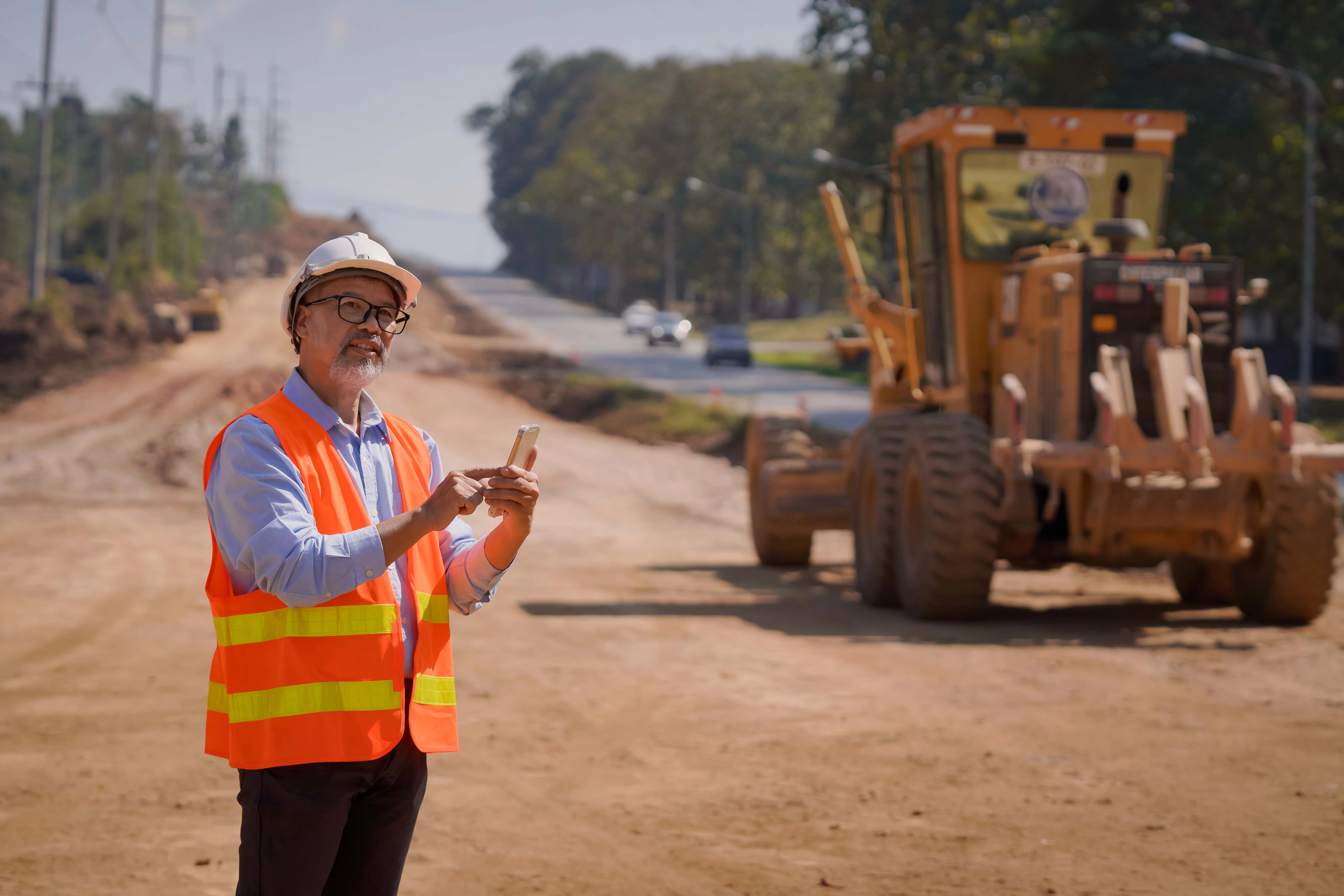 Engineer Worker Working Road Construction Works With Excavator Roller Compac